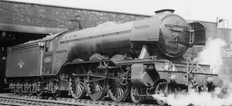 Gresley A3 Pacific No. 60066 'Merry Hampton' with smoke deflectors, at Kings Cross in 1963 (PH.Groom)